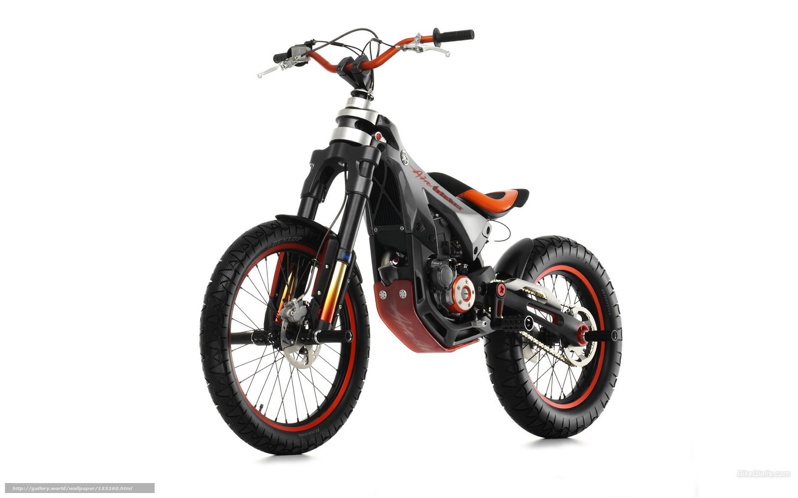 orange and black trial motorcycle