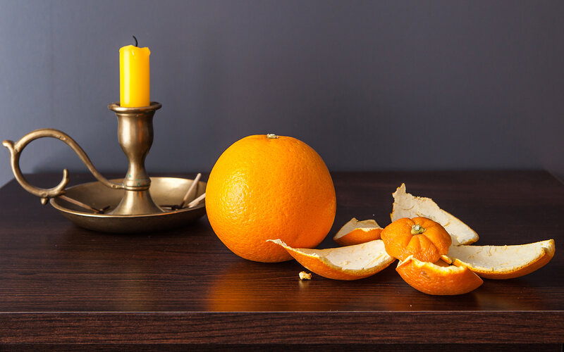 Orange and Candle on Table