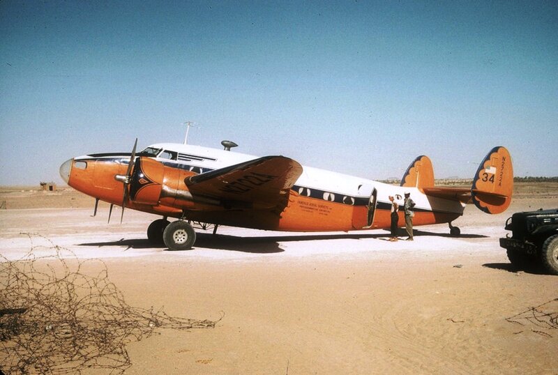 Orange and White Airplane — Desert
