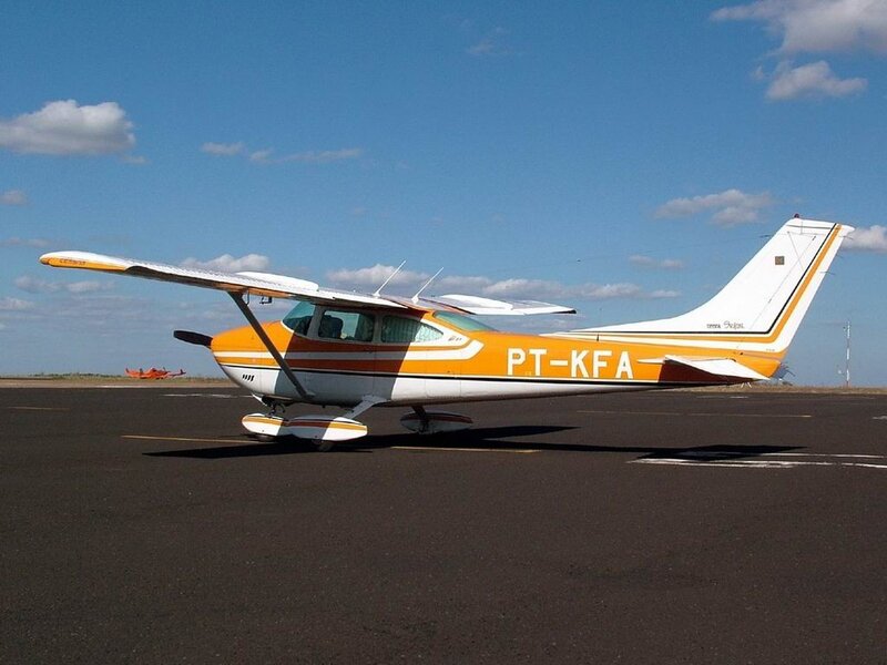 Orange and white airplane on tarmac