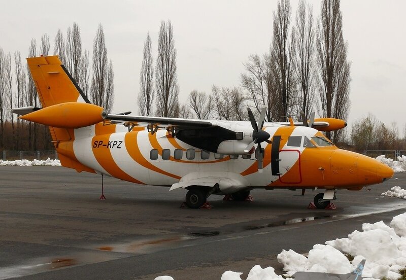 Orange and White Airplane — Overcast