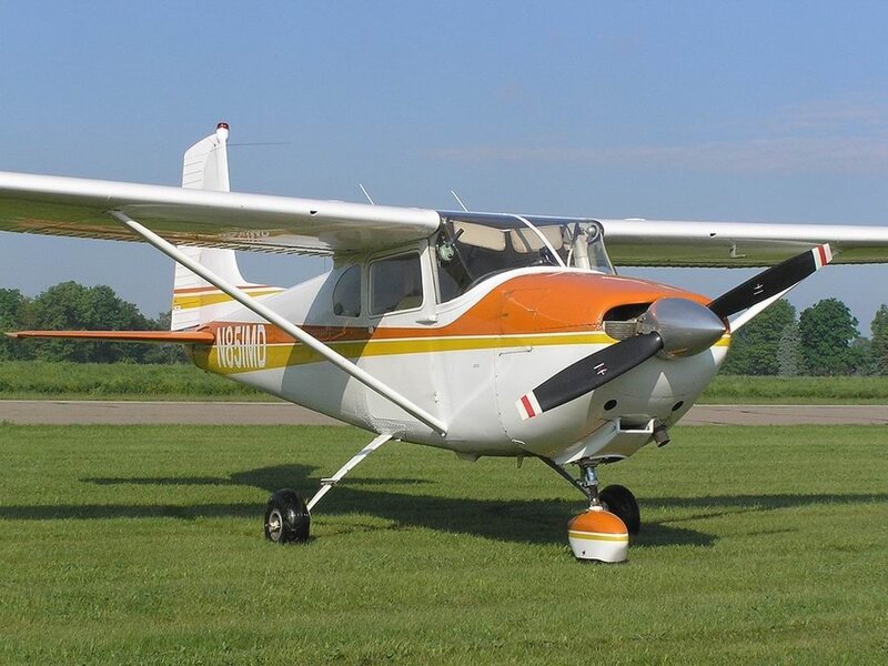 orange and white single-engine plane