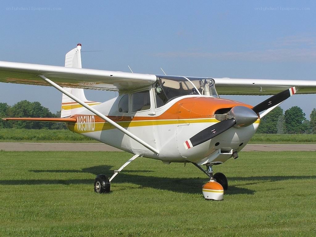 orange and white single-engine plane