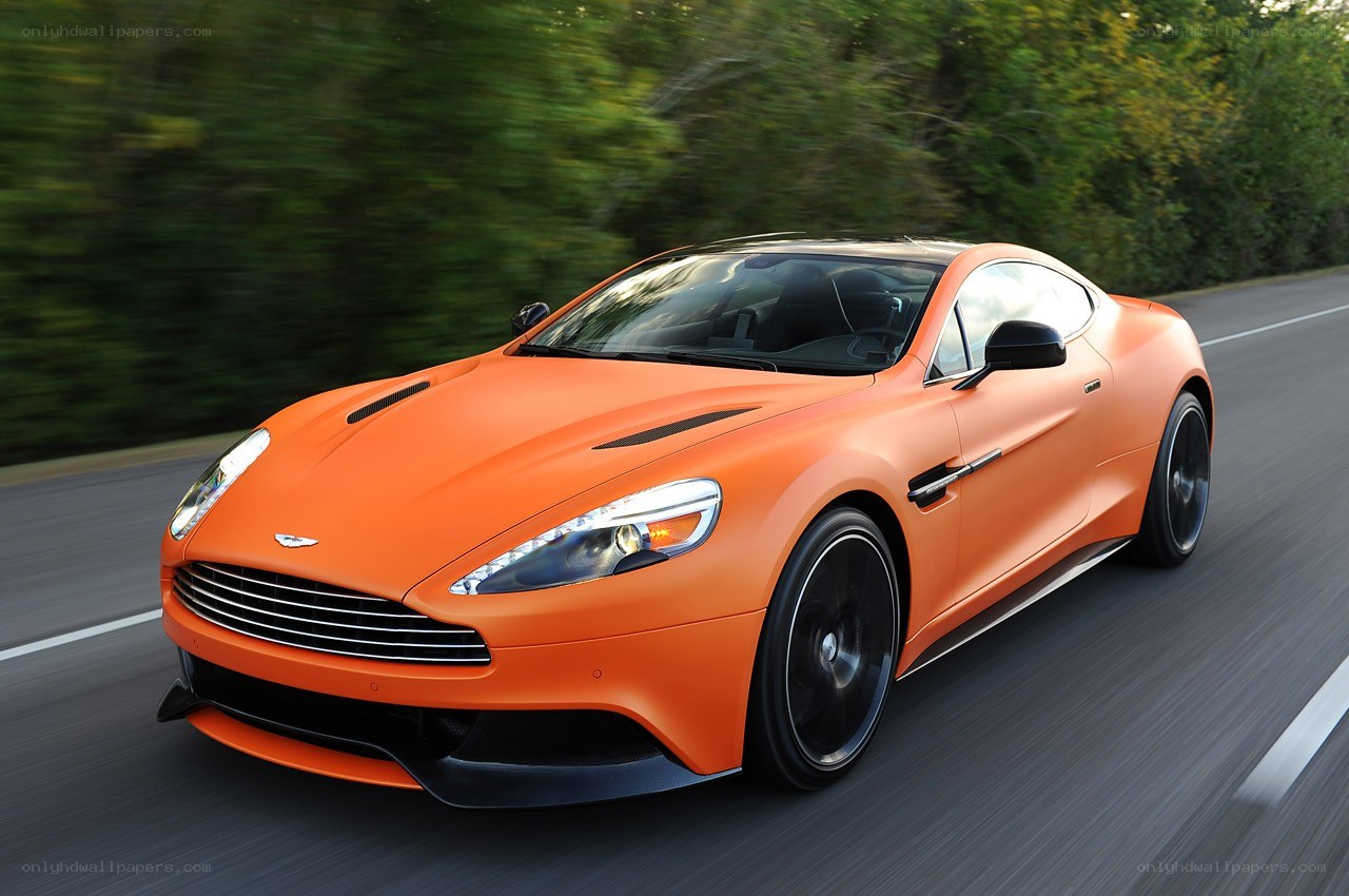 orange Aston Martin on a road