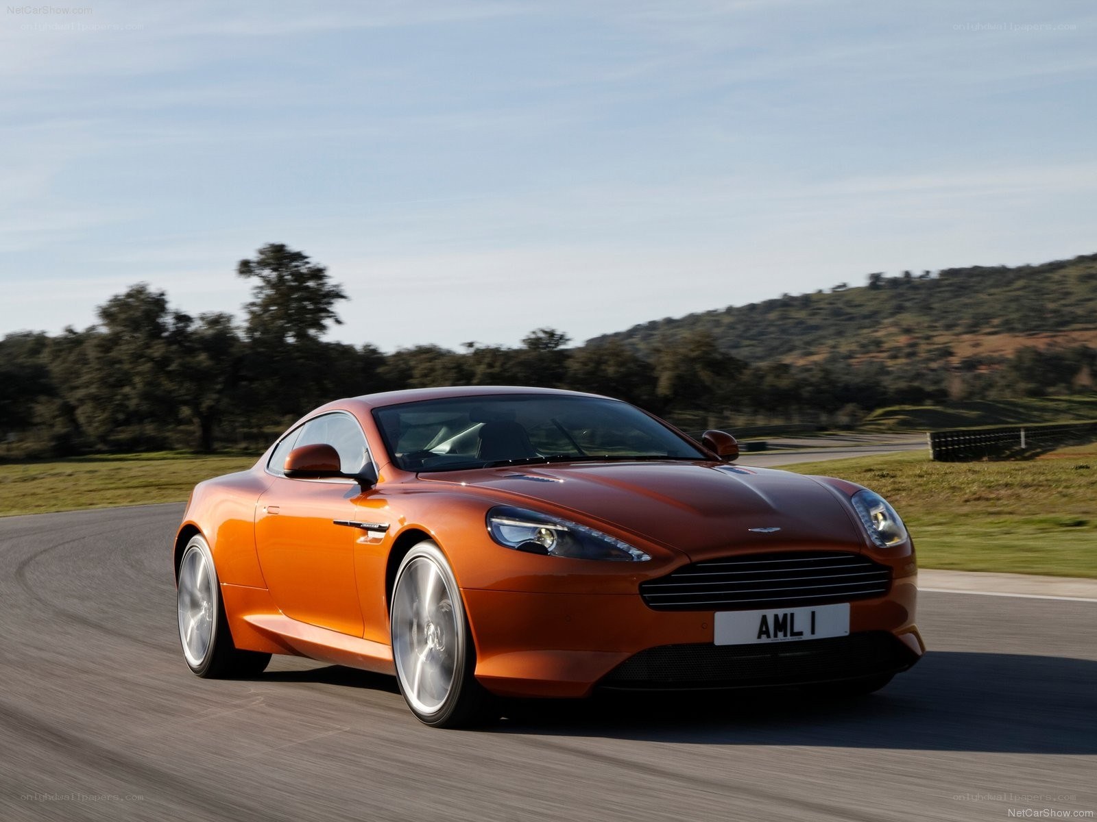 orange aston martin on track