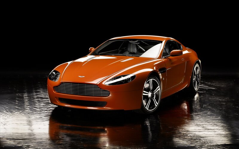 orange Aston Martin sports car