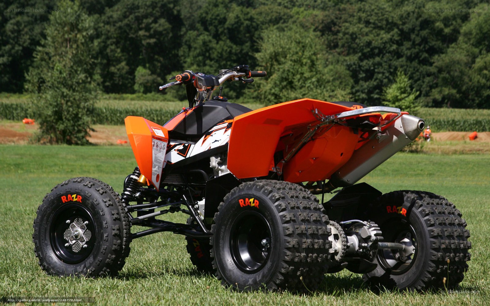 Orange ATV on grass field