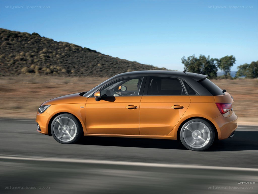 orange audi a1 in motion