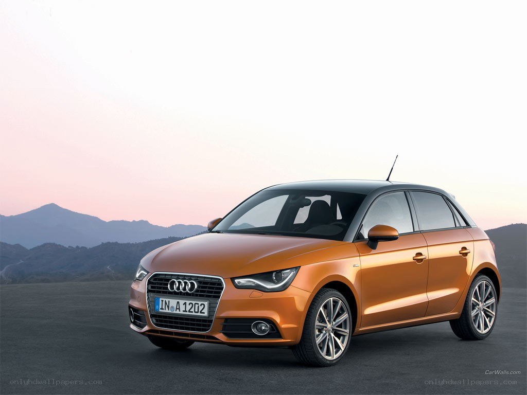 Orange Audi A1 on a road