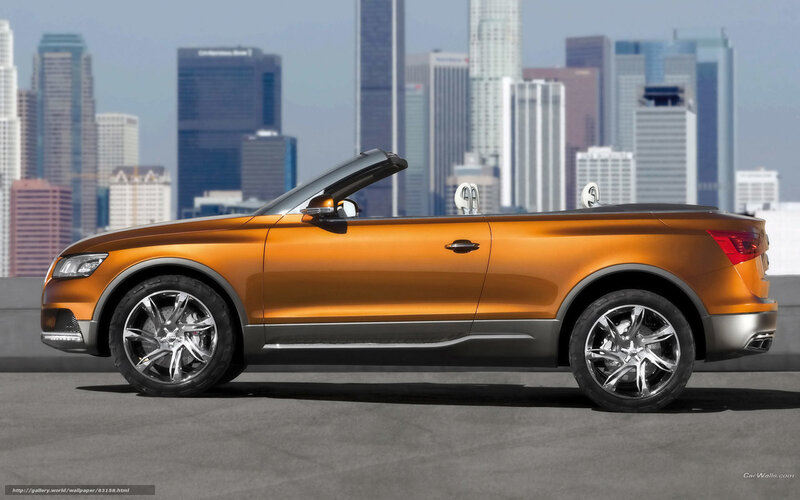 Orange Audi convertible in city