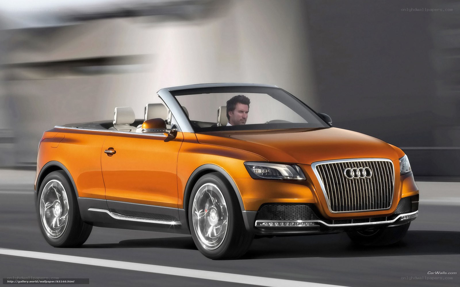 Orange Audi convertible in motion