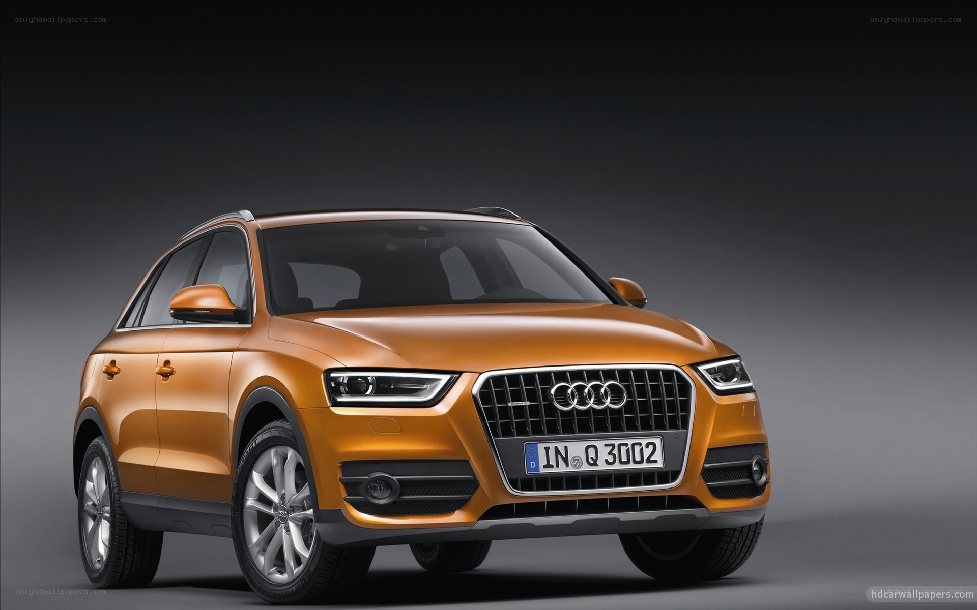 Orange Audi Q3 SUV