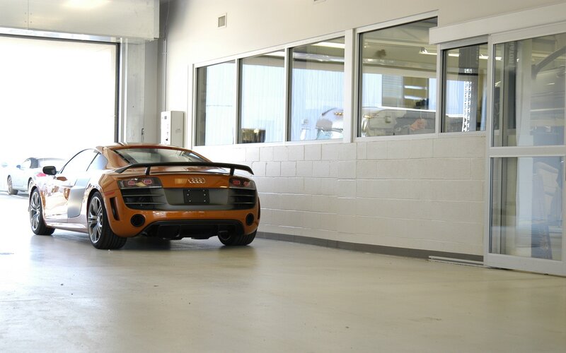 Orange Audi R8 in a garage