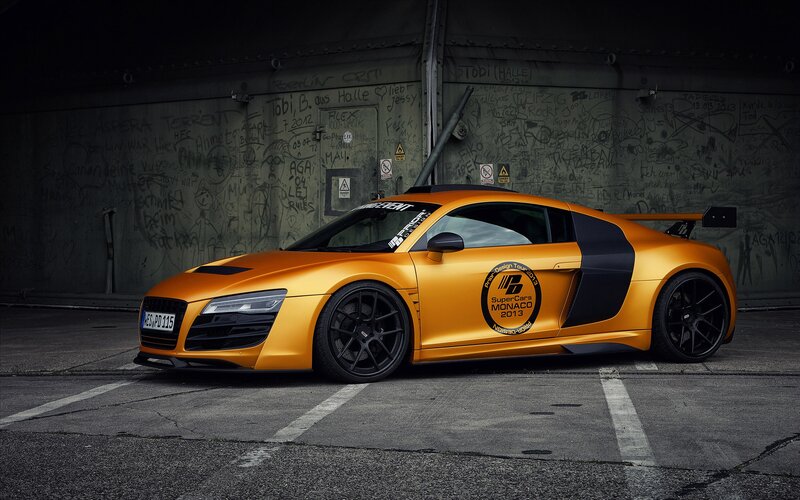 Orange Audi R8 in graffiti alley