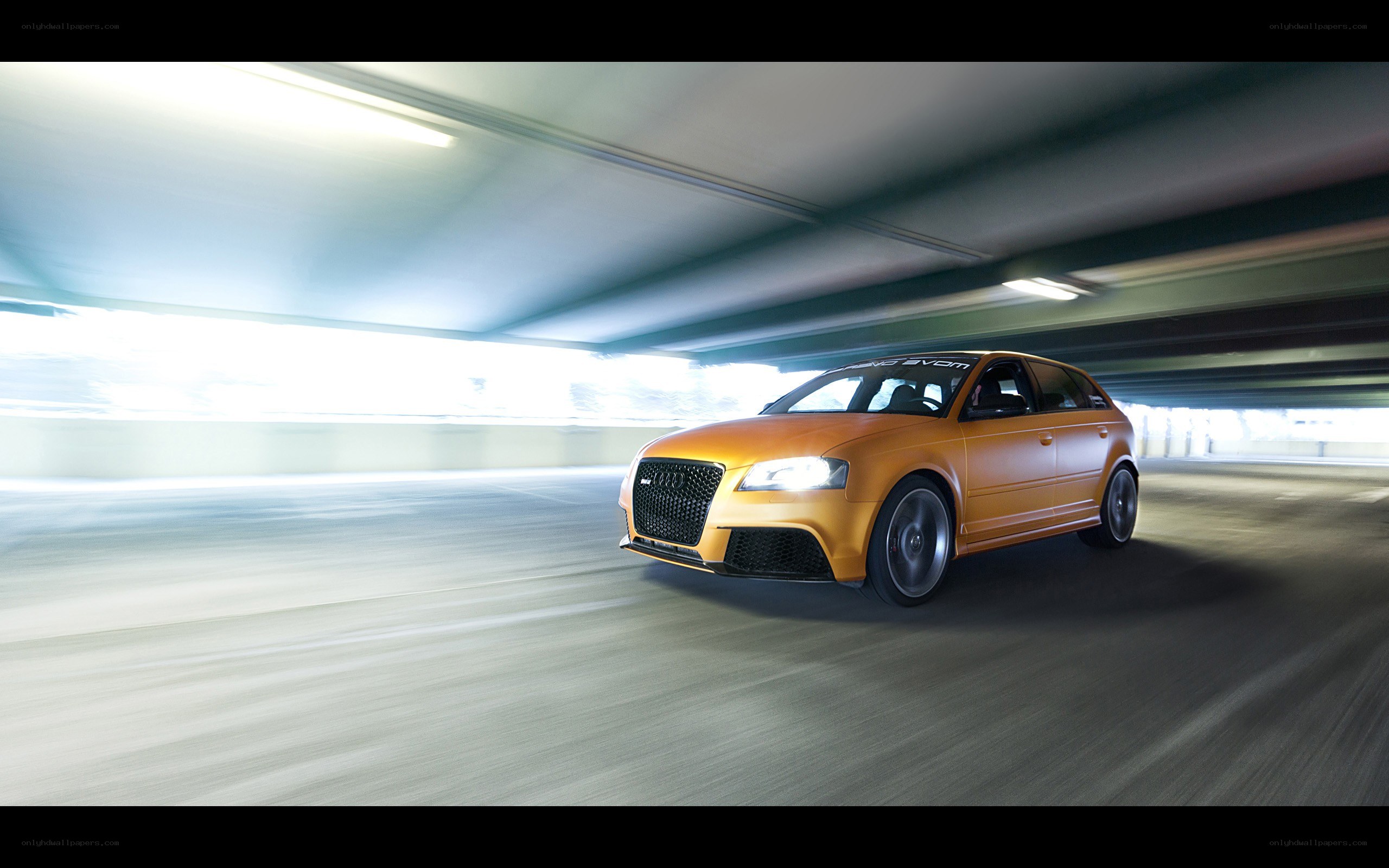 Orange Audi RS3 in tunnel