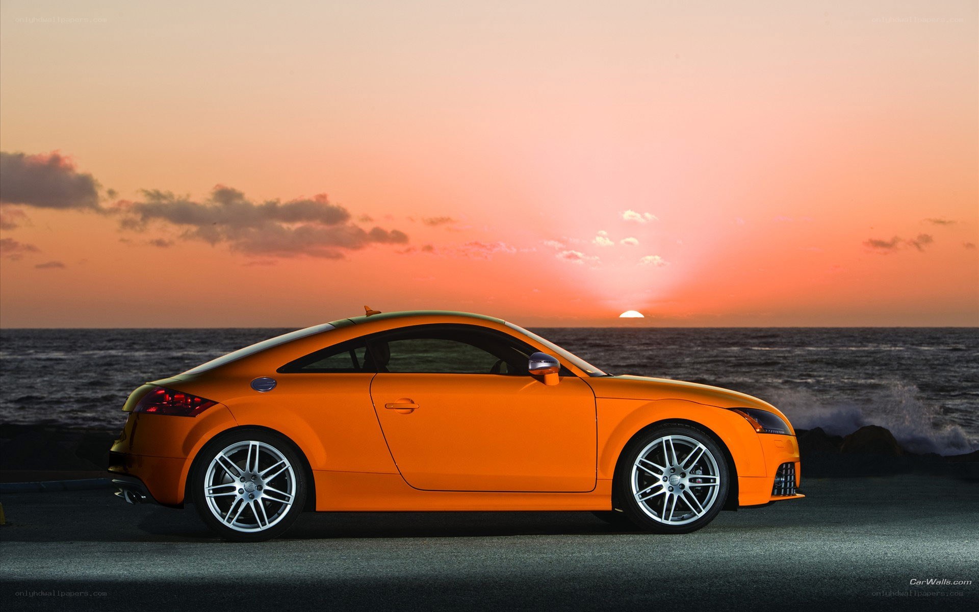 Orange Audi TT at sunset
