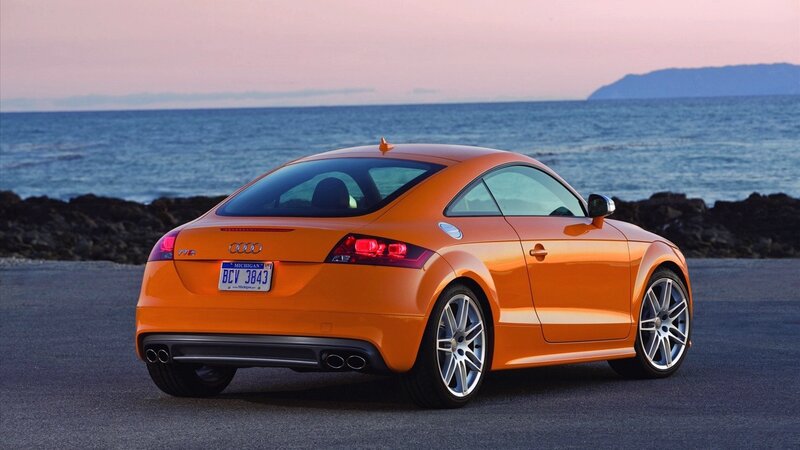 Orange Audi TT by the sea