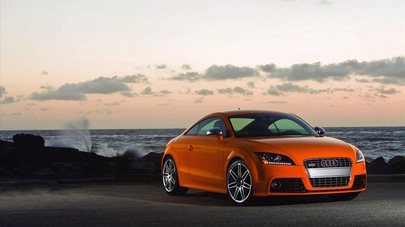 Orange Audi TT by the sea