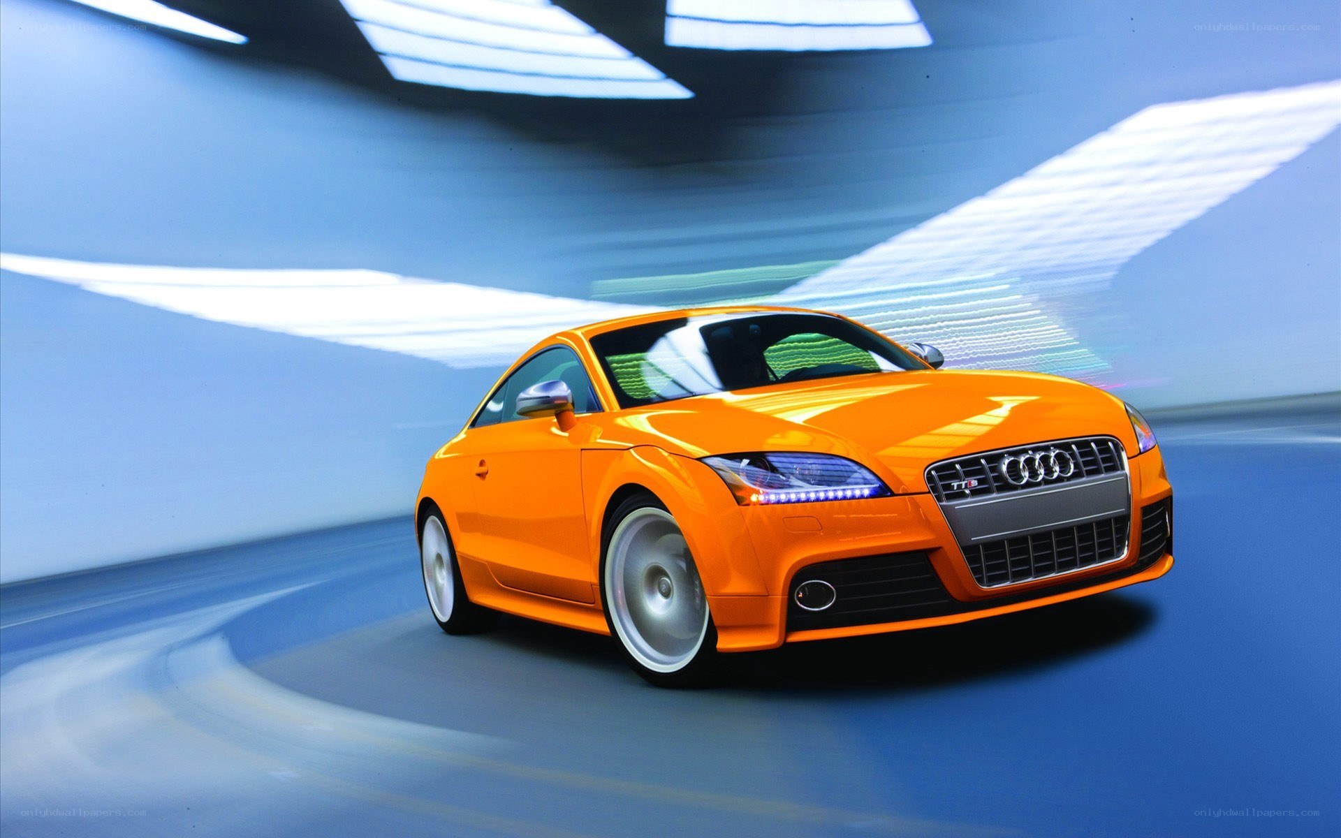 Orange Audi TT in motion