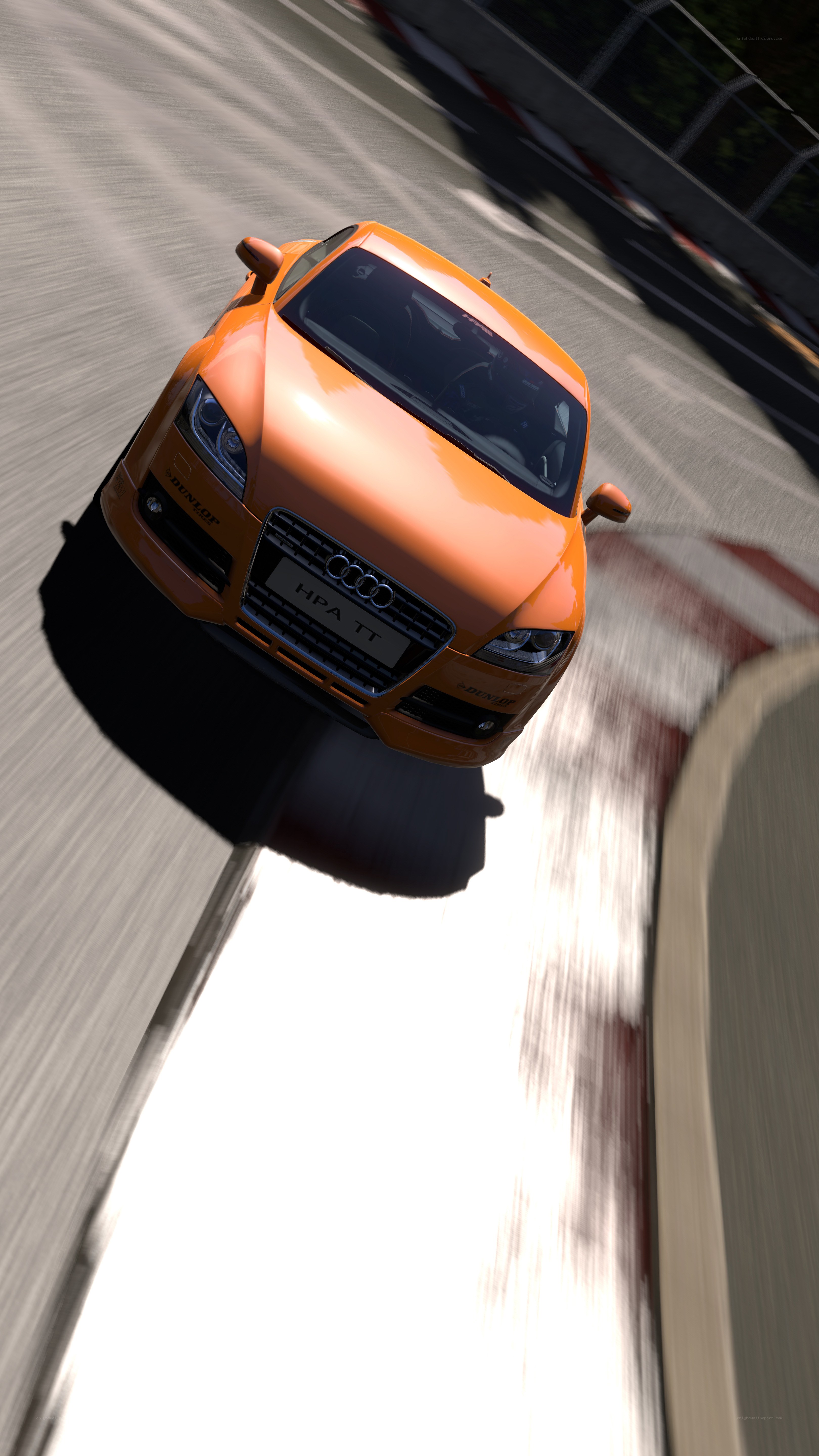 Orange Audi TT on a racetrack