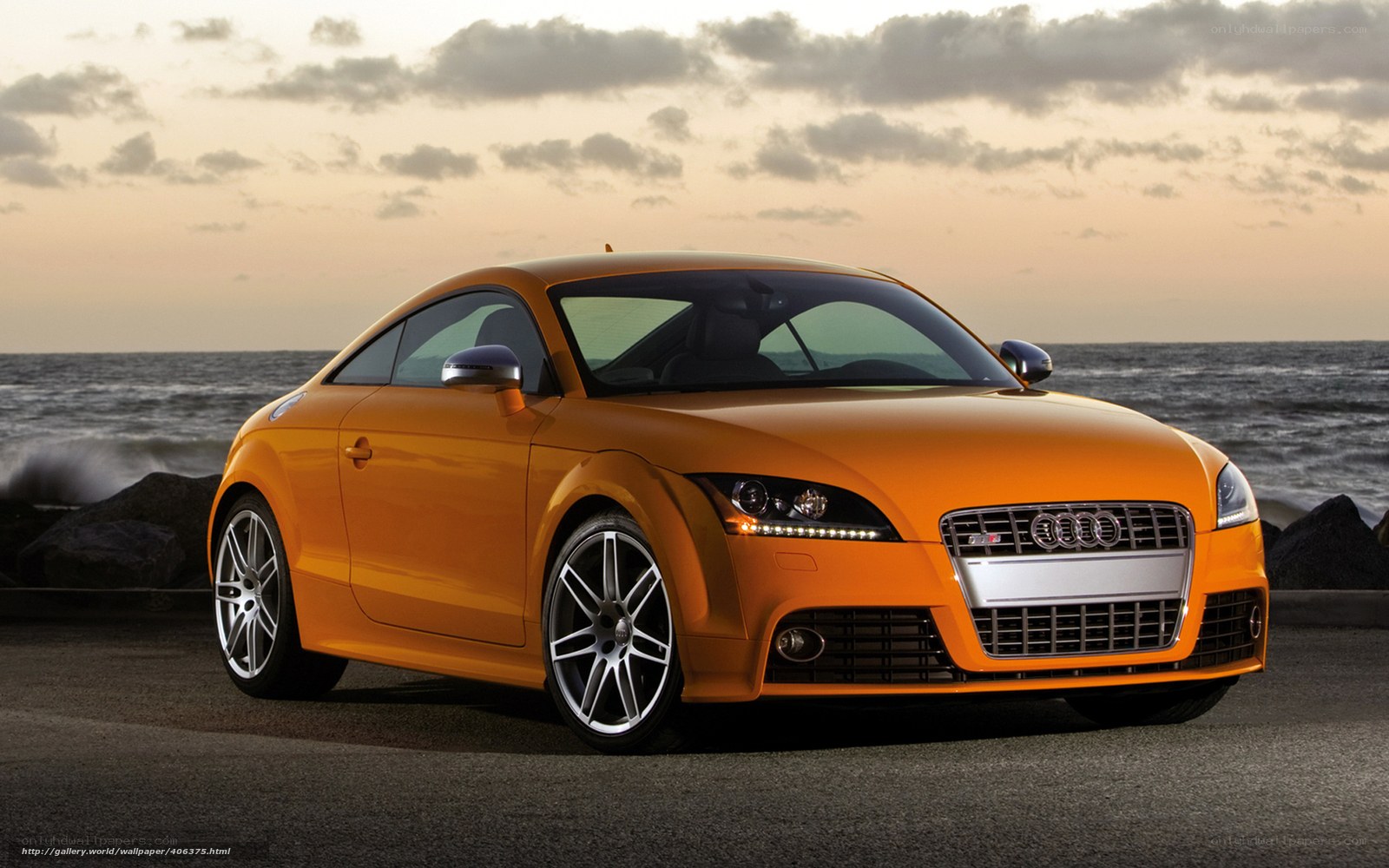 Orange Audi TT on coastal road