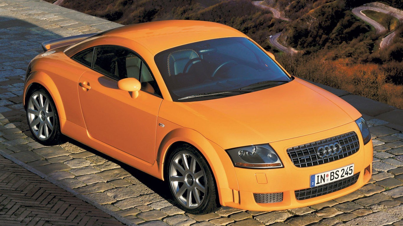 Orange Audi TT on cobblestone