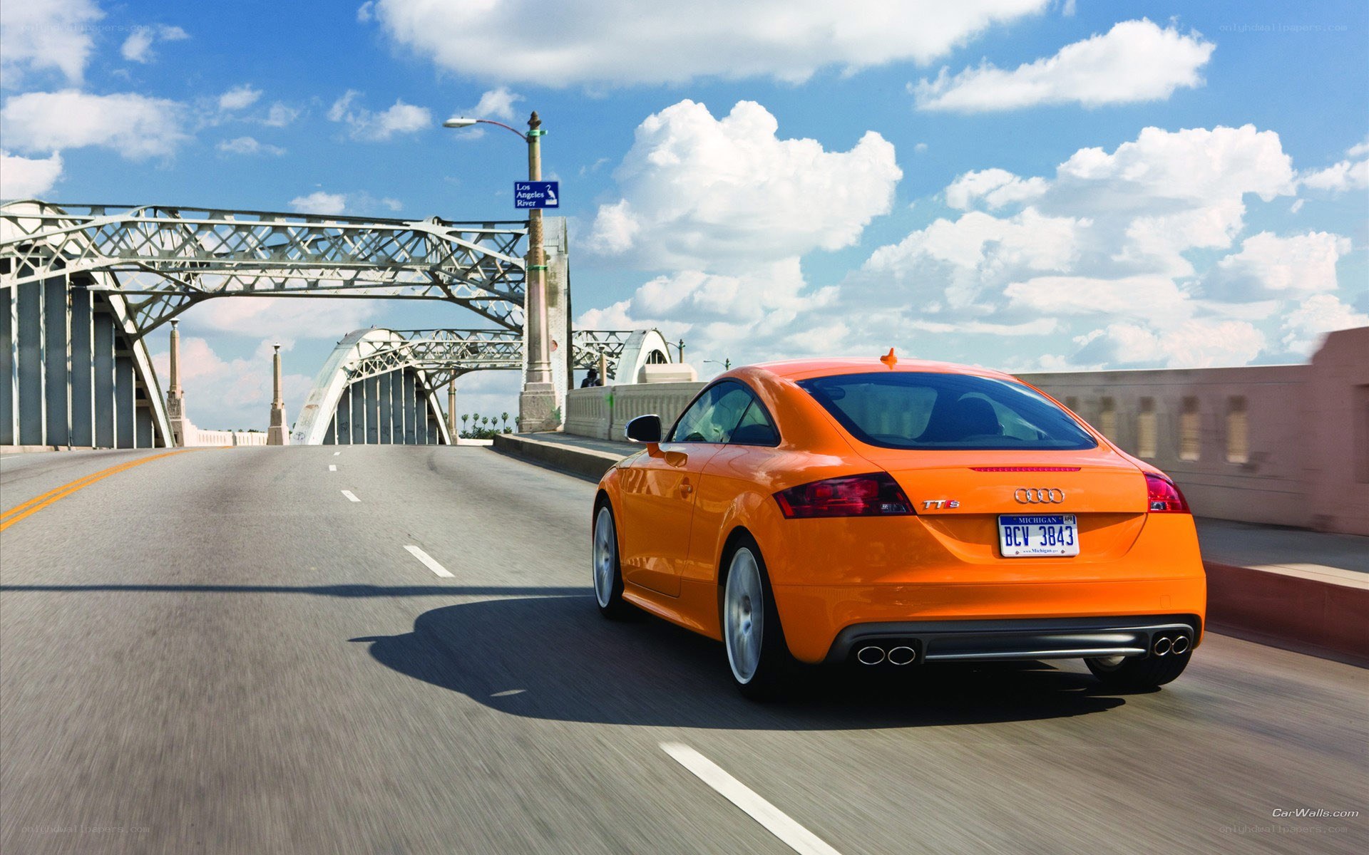 Orange Audi TT S on a bridge