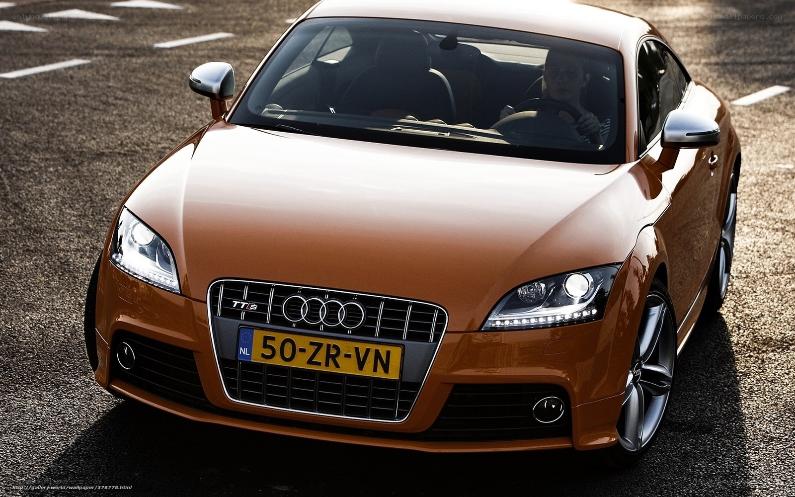 Orange Audi TT S on asphalt