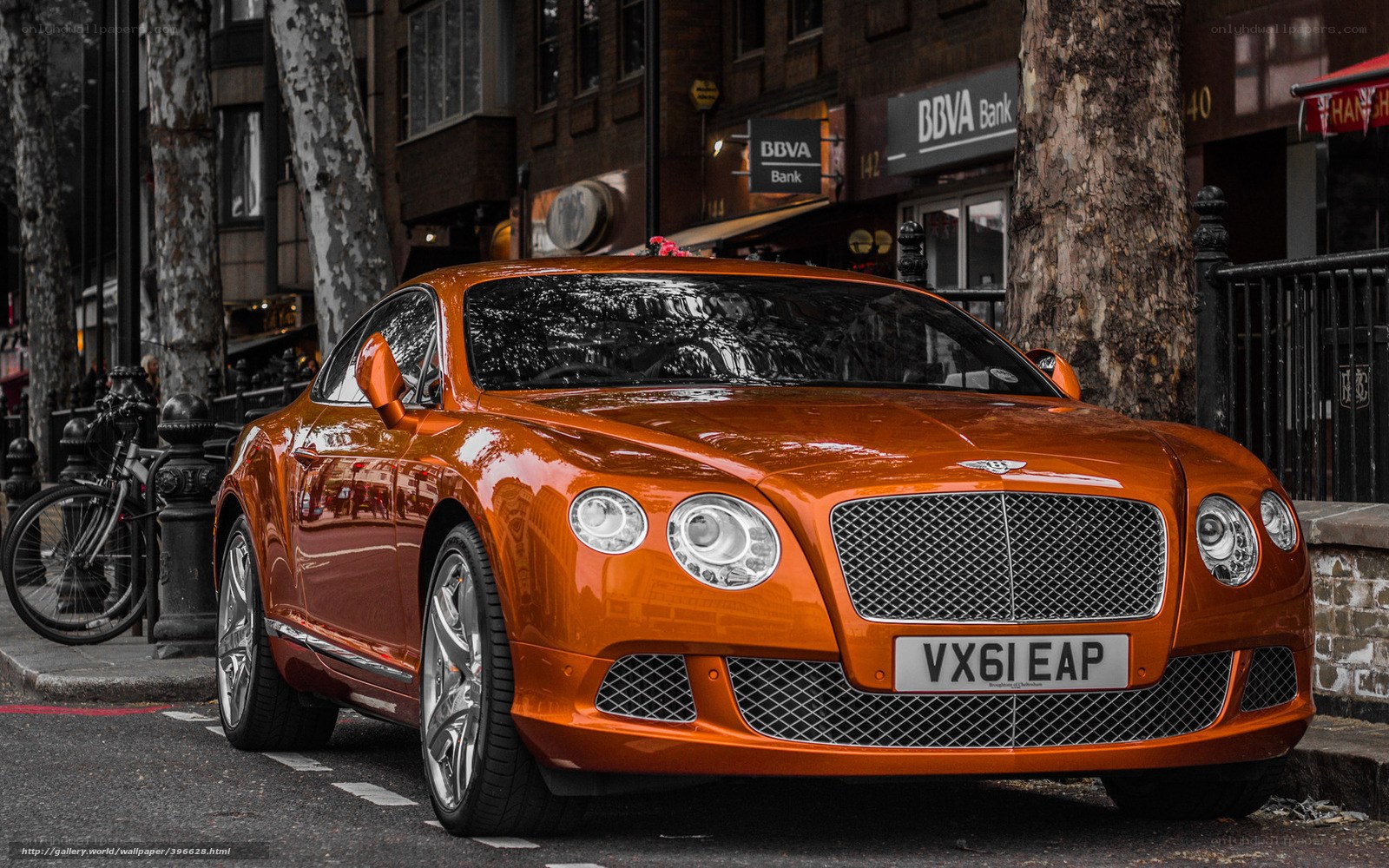 Orange Bentley on city street