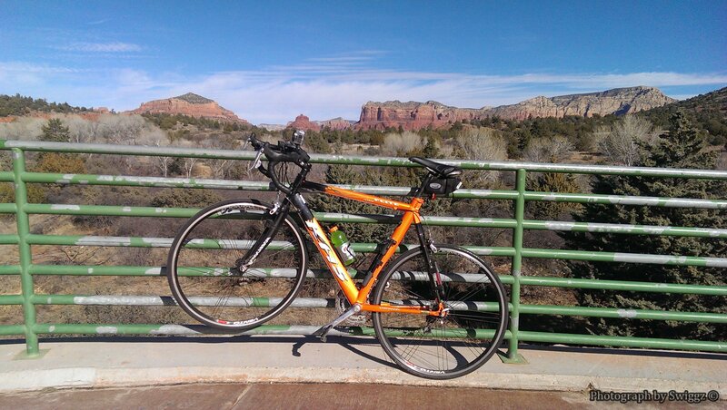Orange Bicycle on Bridge