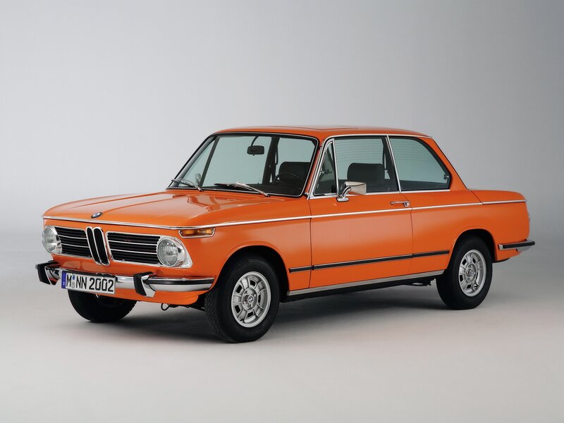 Orange BMW 2002 sedan