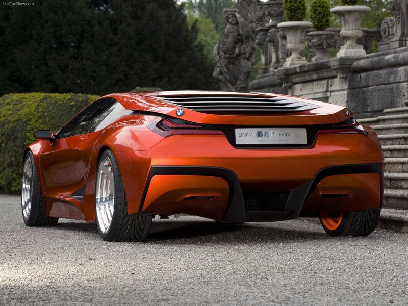 Orange BMW Concept Car — Dramatic, Afternoon, Photograph, Statue, Hedges