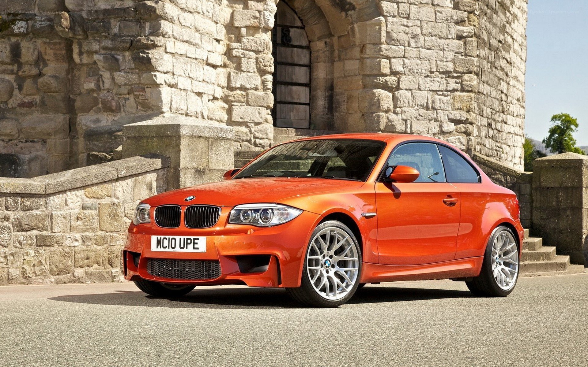 Orange BMW coupe parked