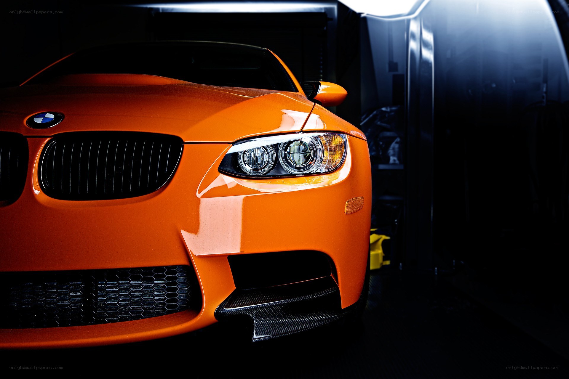 orange BMW in a garage