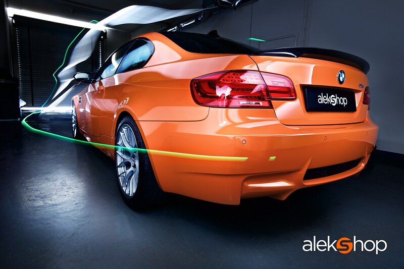 Orange BMW in a studio