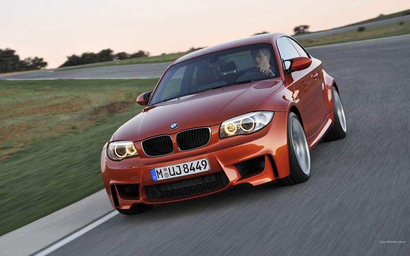 Orange BMW M1 on a racetrack