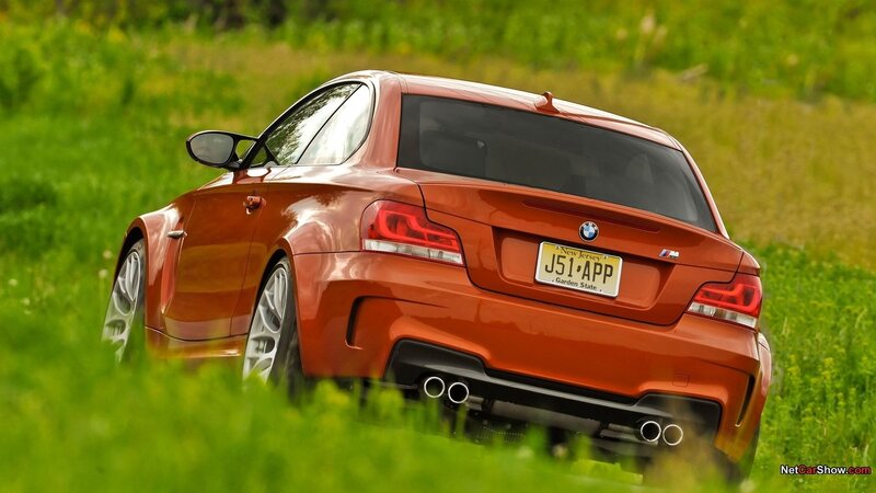Orange BMW M135i in a field