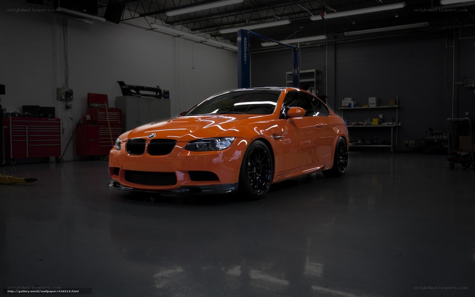 Orange BMW M3 in garage