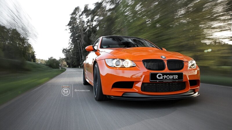 orange bmw m3 in motion
