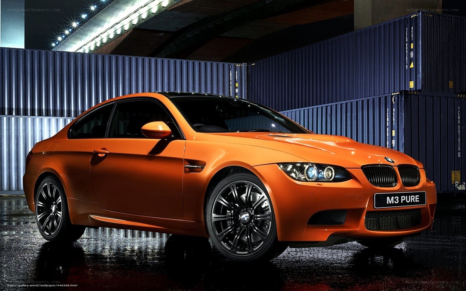 Orange BMW M3 in urban setting