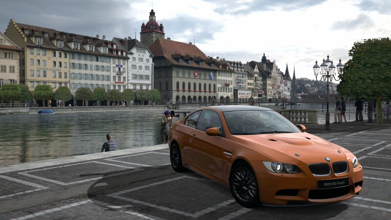 Orange BMW M3 on a city street