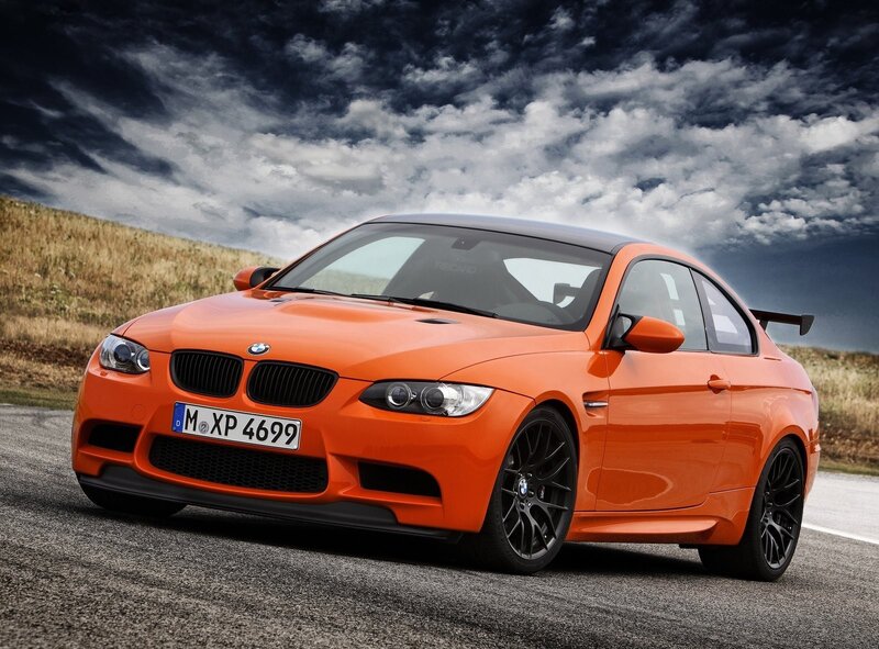 Orange BMW M3 on a road