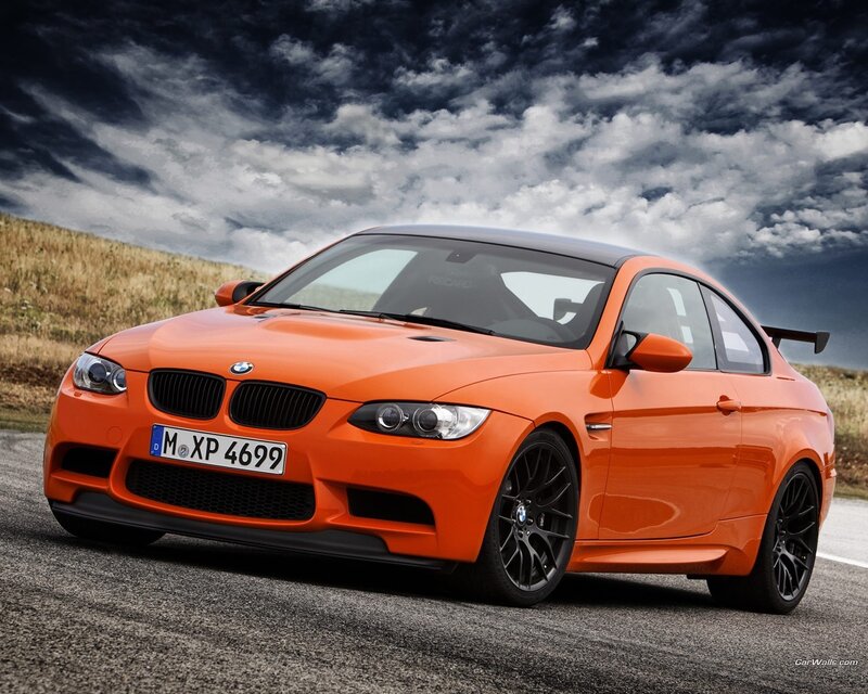 Orange BMW M3 on a road