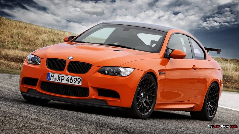 Orange BMW M3 on a road
