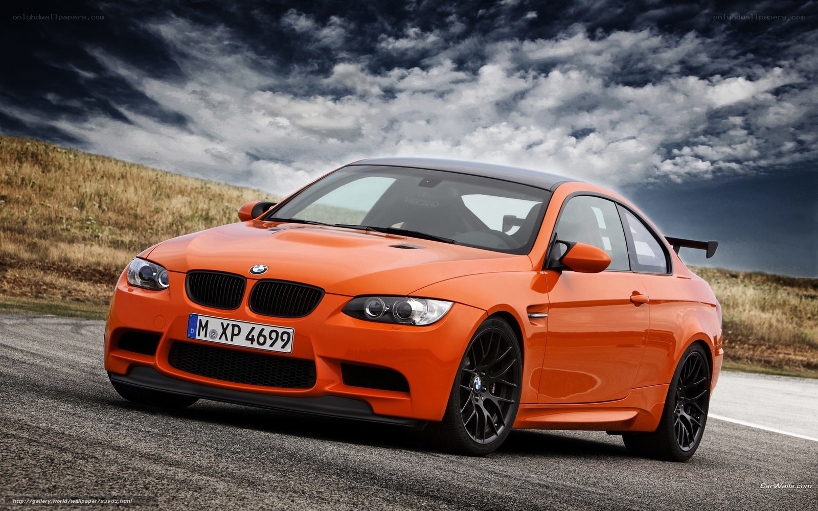 Orange BMW M3 on a road