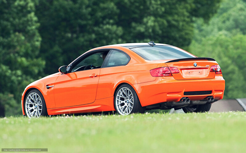 Orange BMW M3 on grass