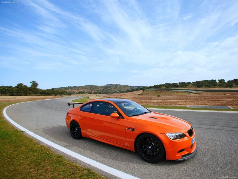 orange bmw m3 on racetrack