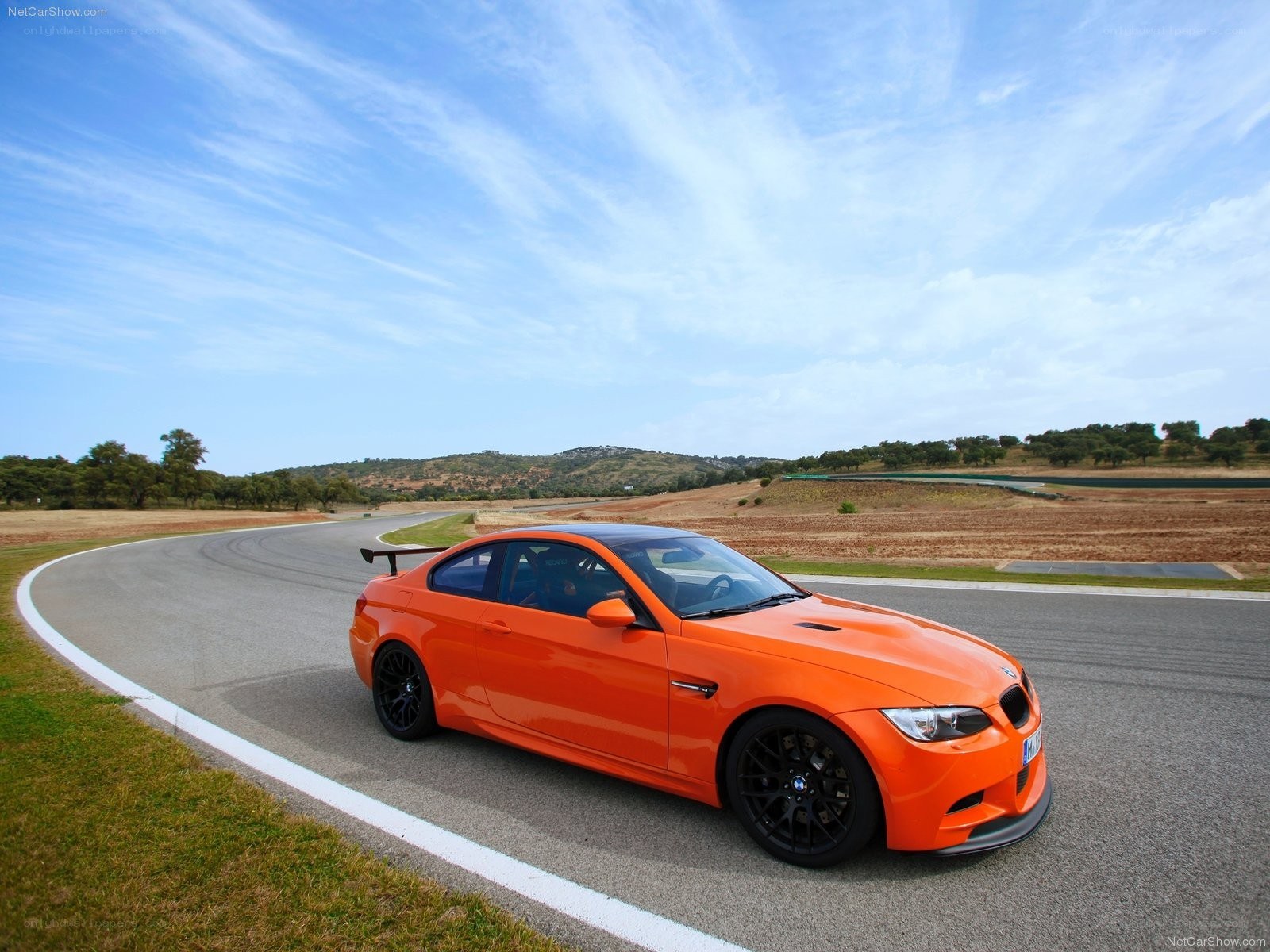 orange bmw m3 on racetrack
