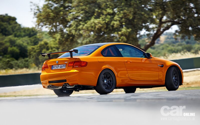 orange bmw m3 on racetrack