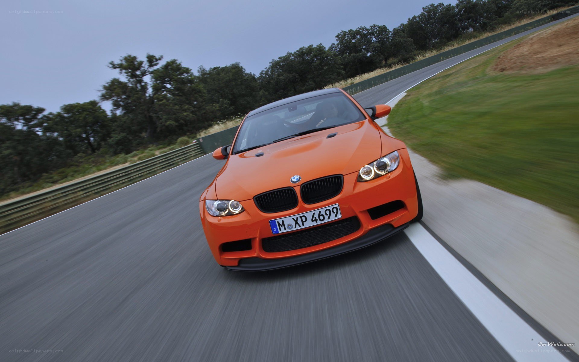 orange bmw m3 on racetrack